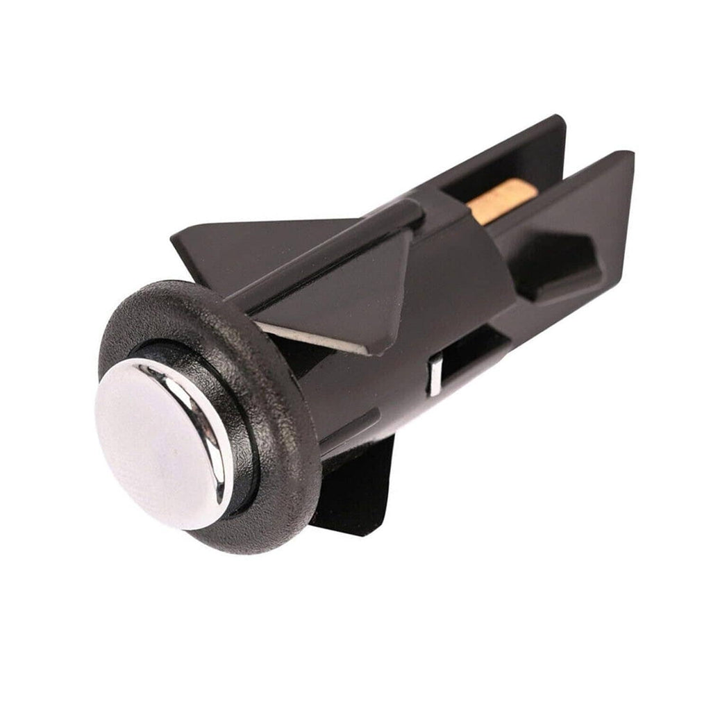 Fuel door release switch with black housing and chrome round button, front-left view