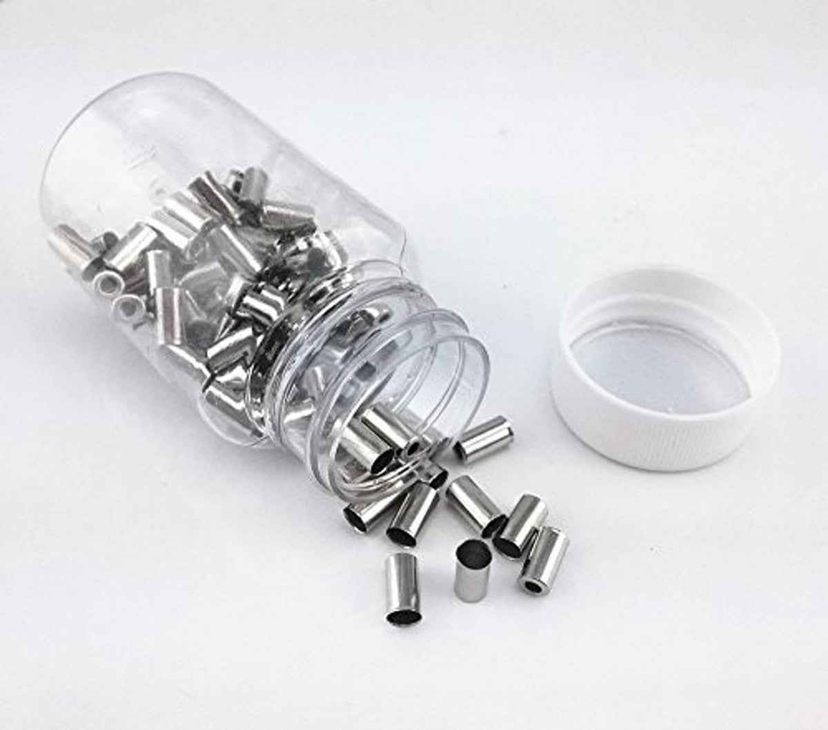 Bike brake cable ferrules, clear container with loose silver ferrules and a white cap