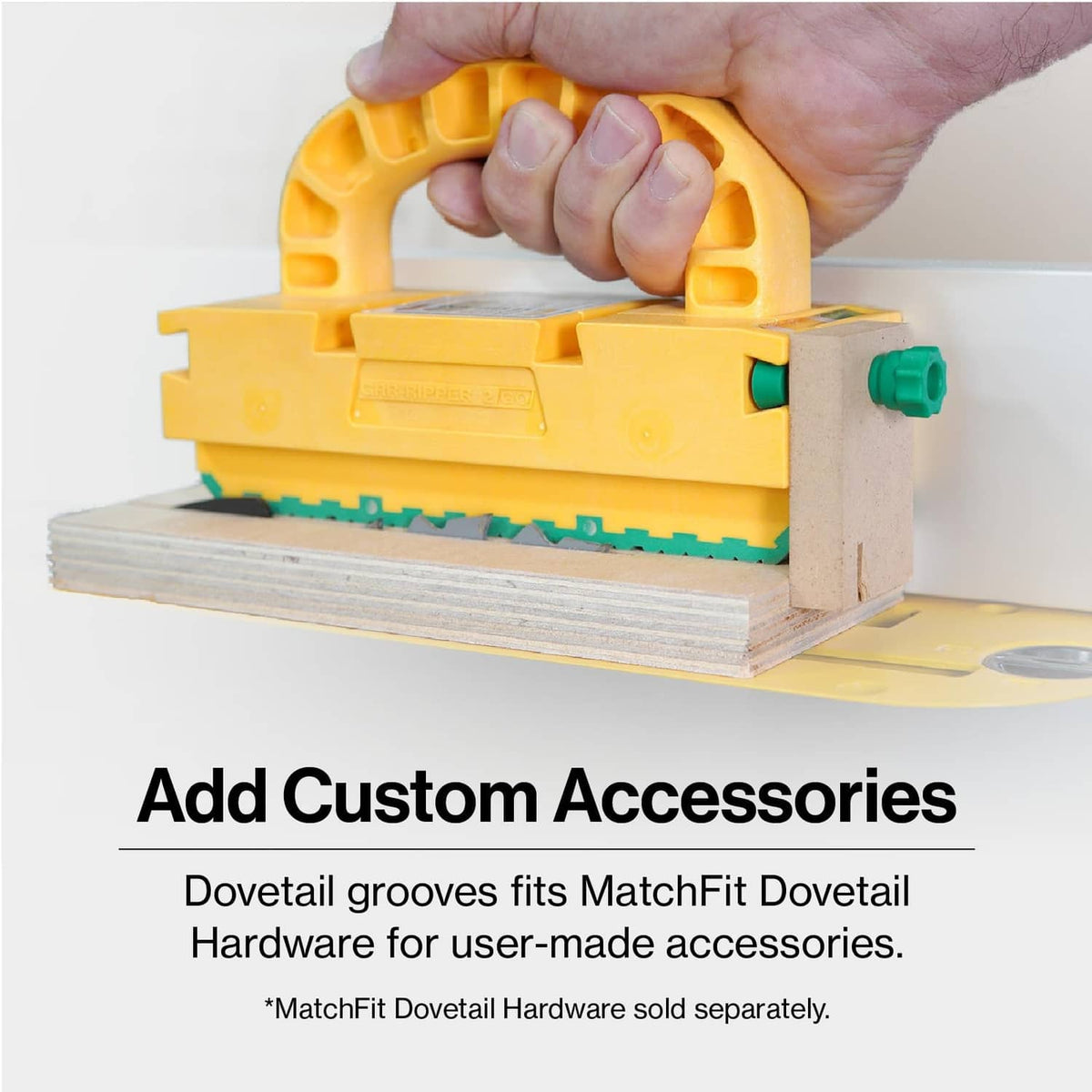 Yellow push block on wood surface with green toothed edge and mounting holes