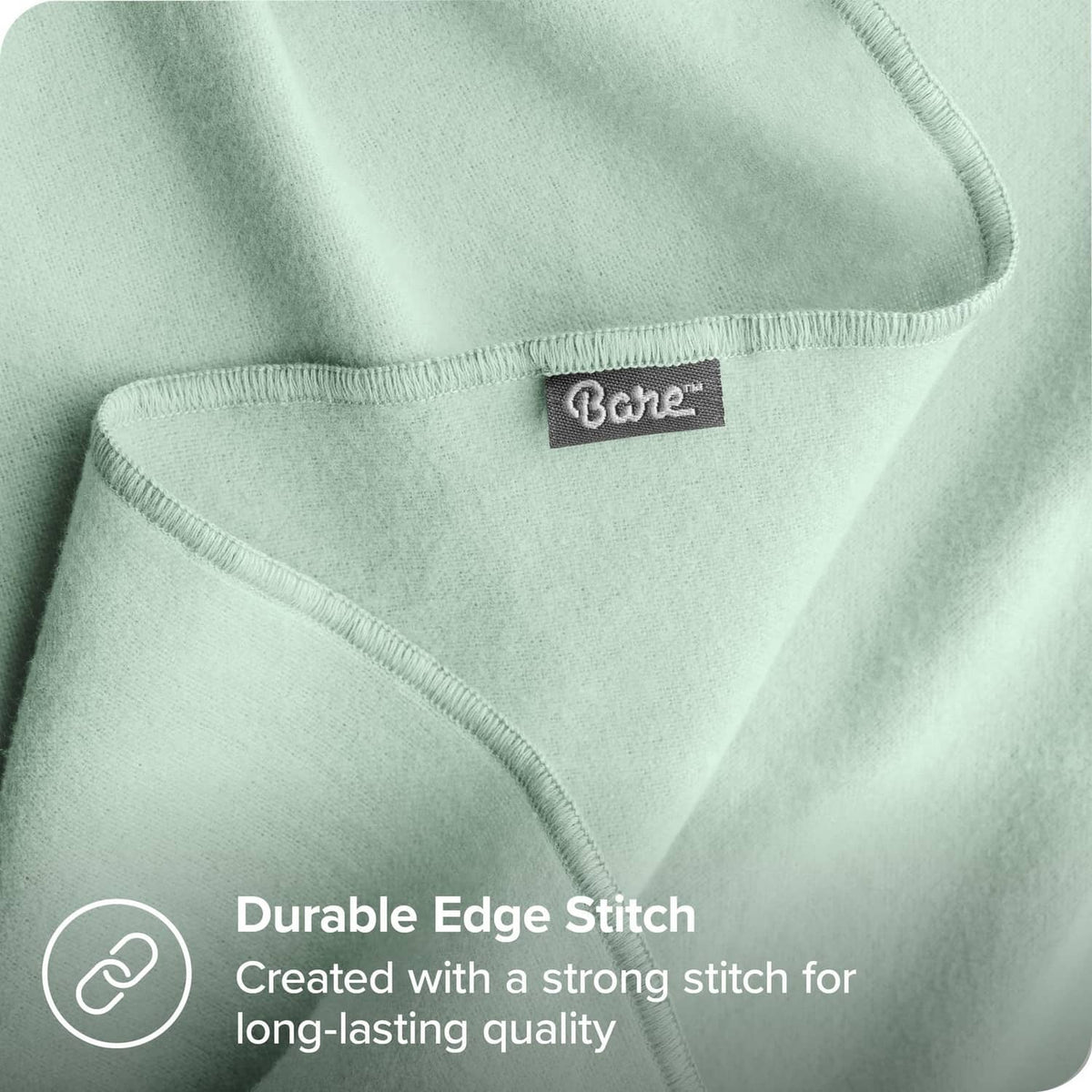 Mint green baby blanket corner with durable stitched edge and fabric label