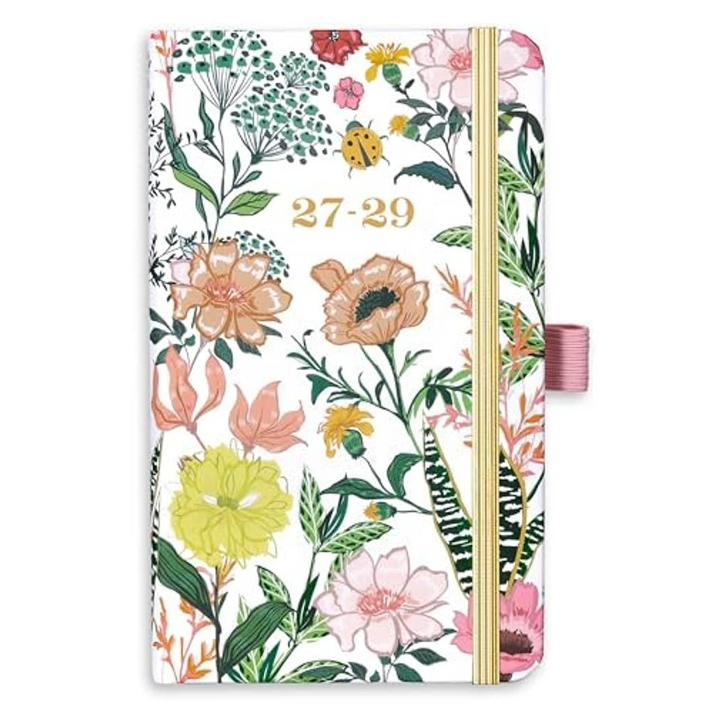Pocket planner with white floral cover, gold elastic band, and ribbon tab bookmark, 27-29