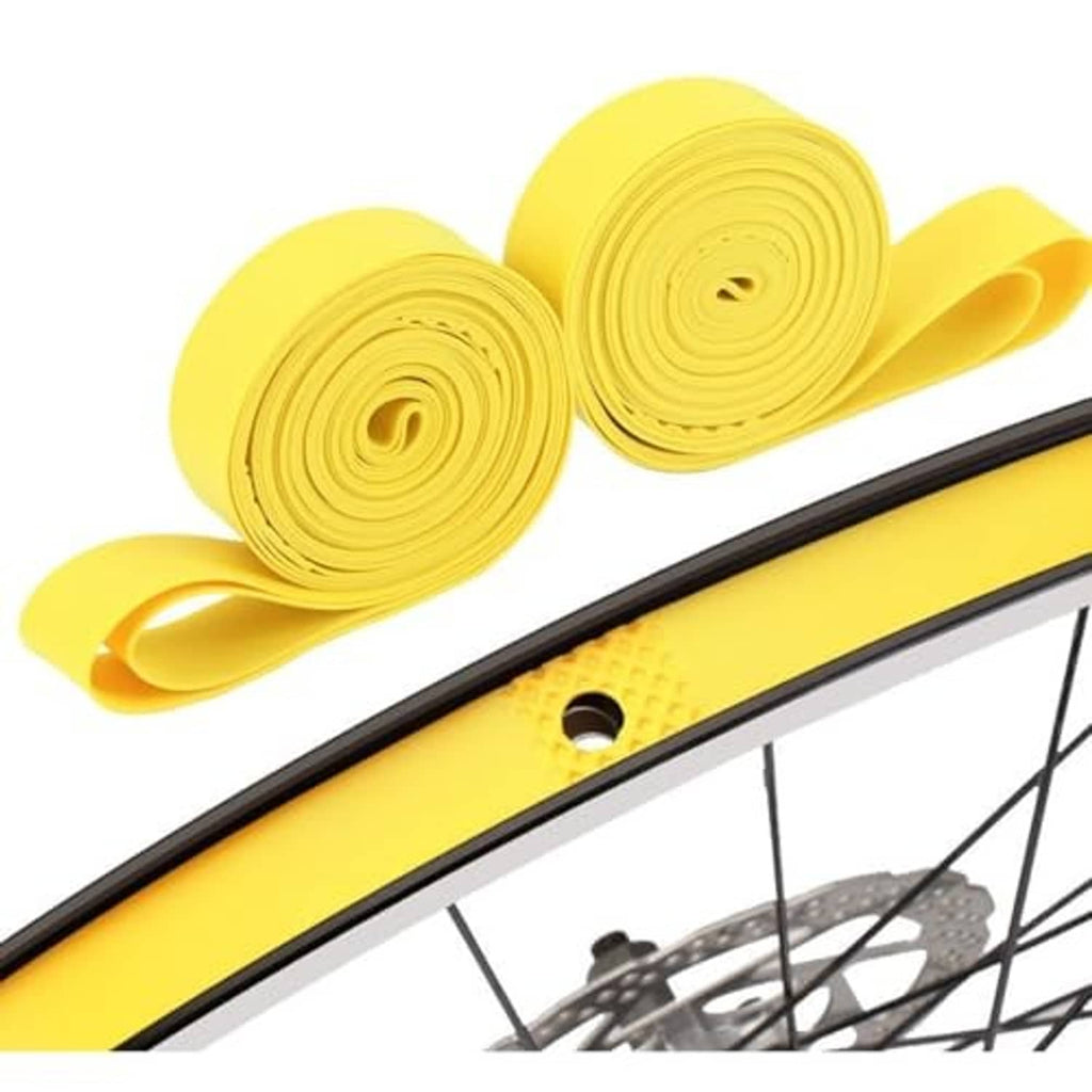 Yellow puncture protection tape rolls positioned along bicycle tire edge