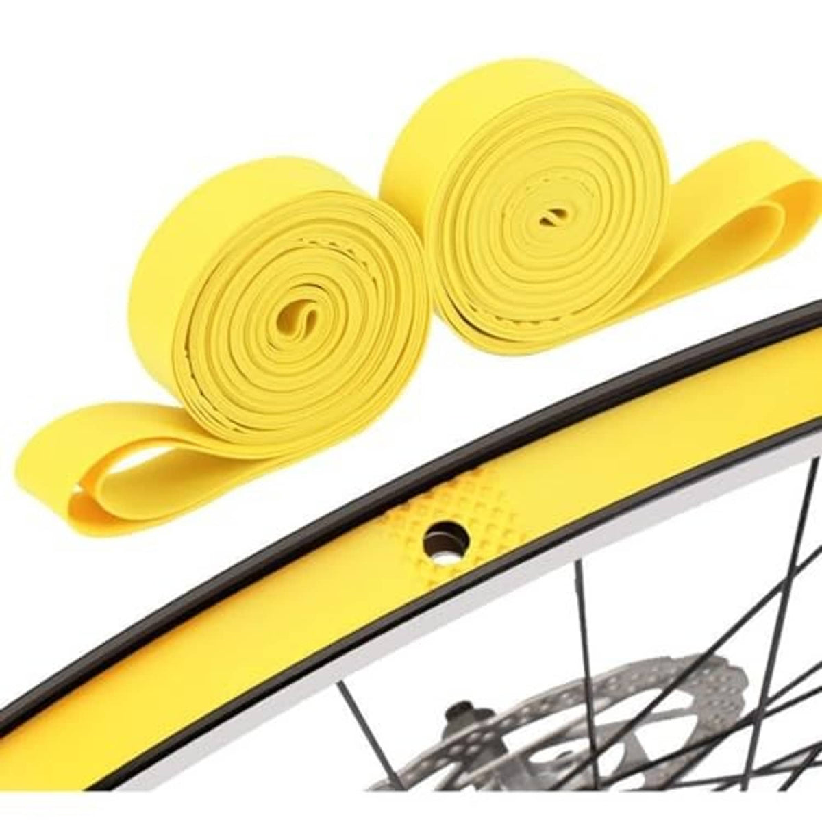 Yellow puncture protection tape rolls positioned along bicycle tire edge