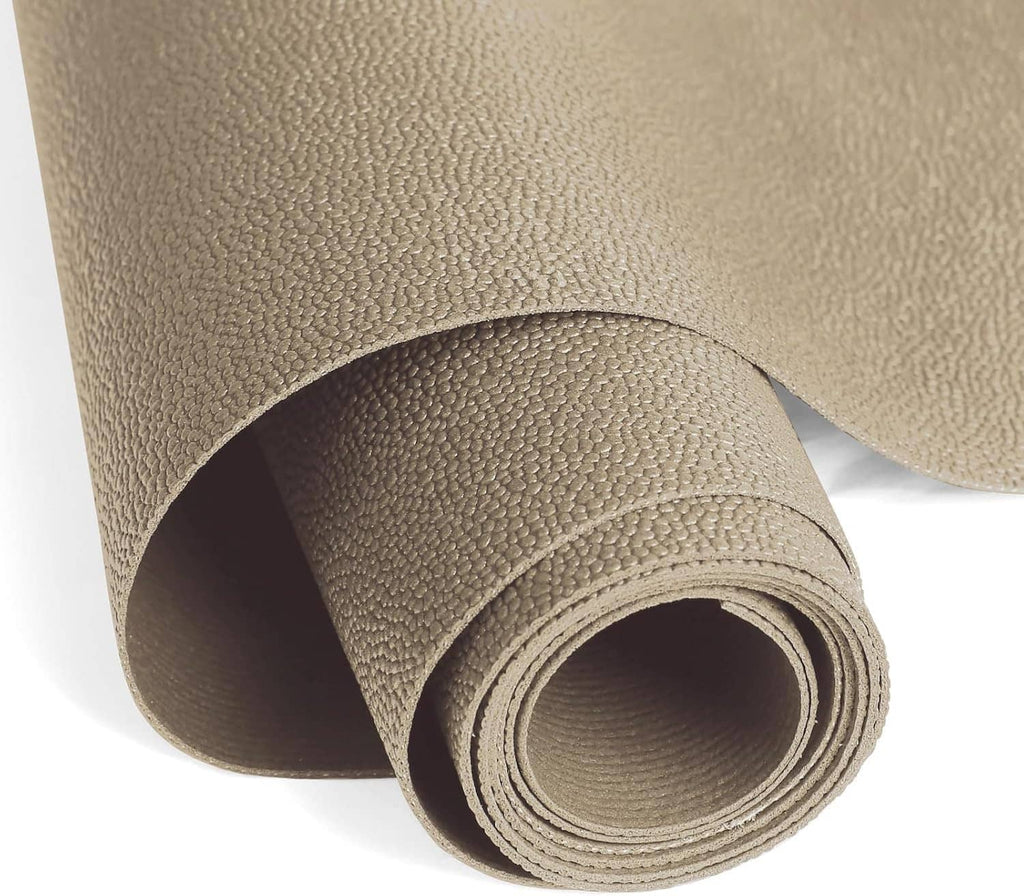Close-up of rolled beige non-slip liner foam mat with pebbled texture