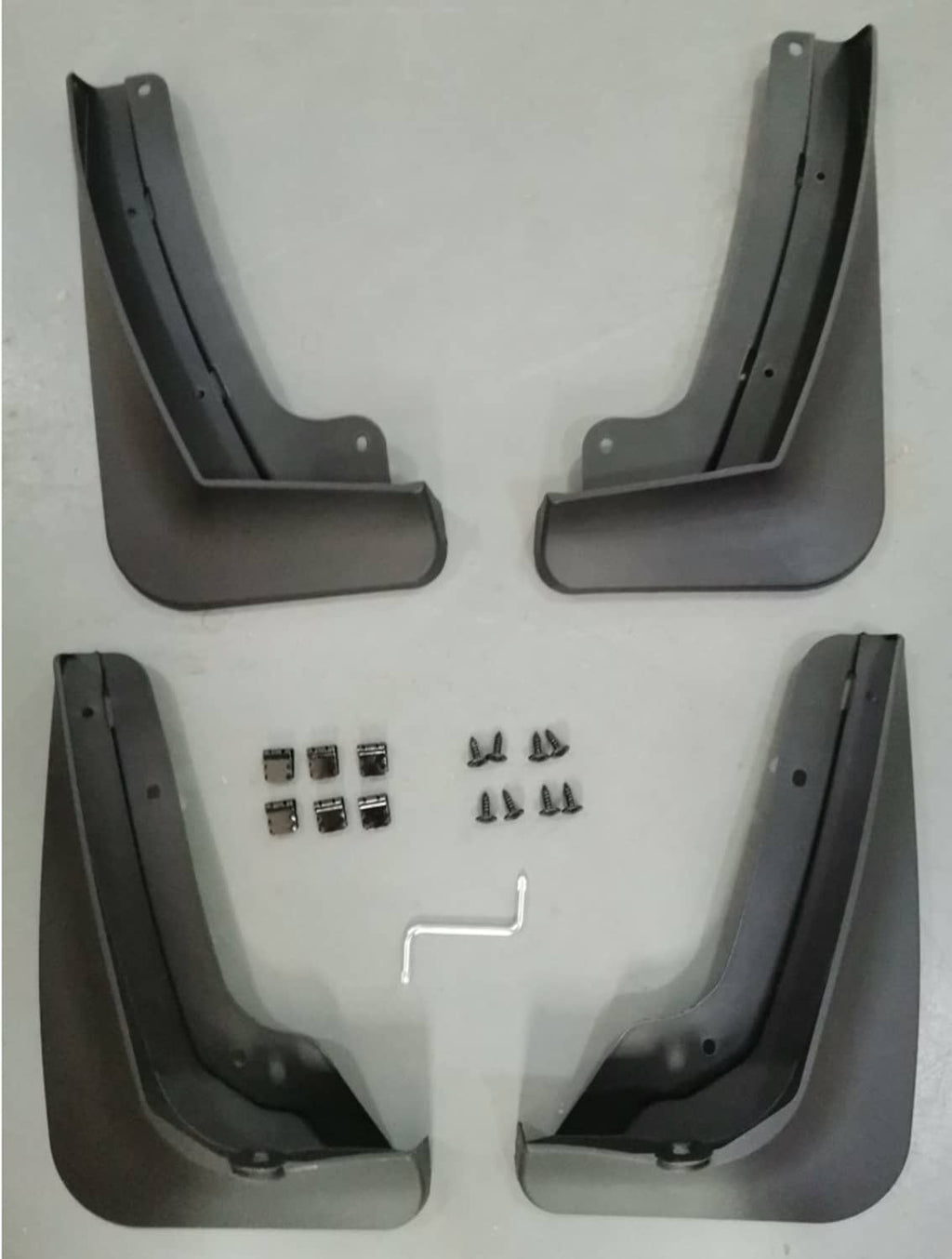 Set of black car splash guards with mounting holes and included hardware