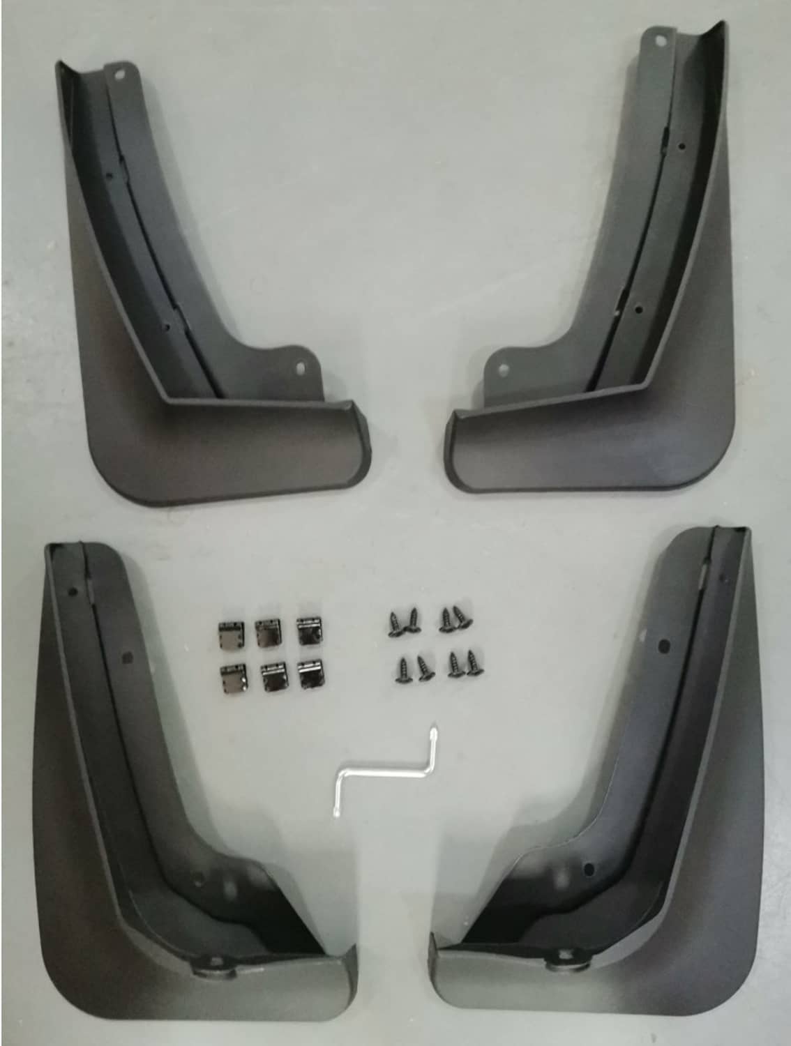 Set of black car splash guards with mounting holes and included hardware