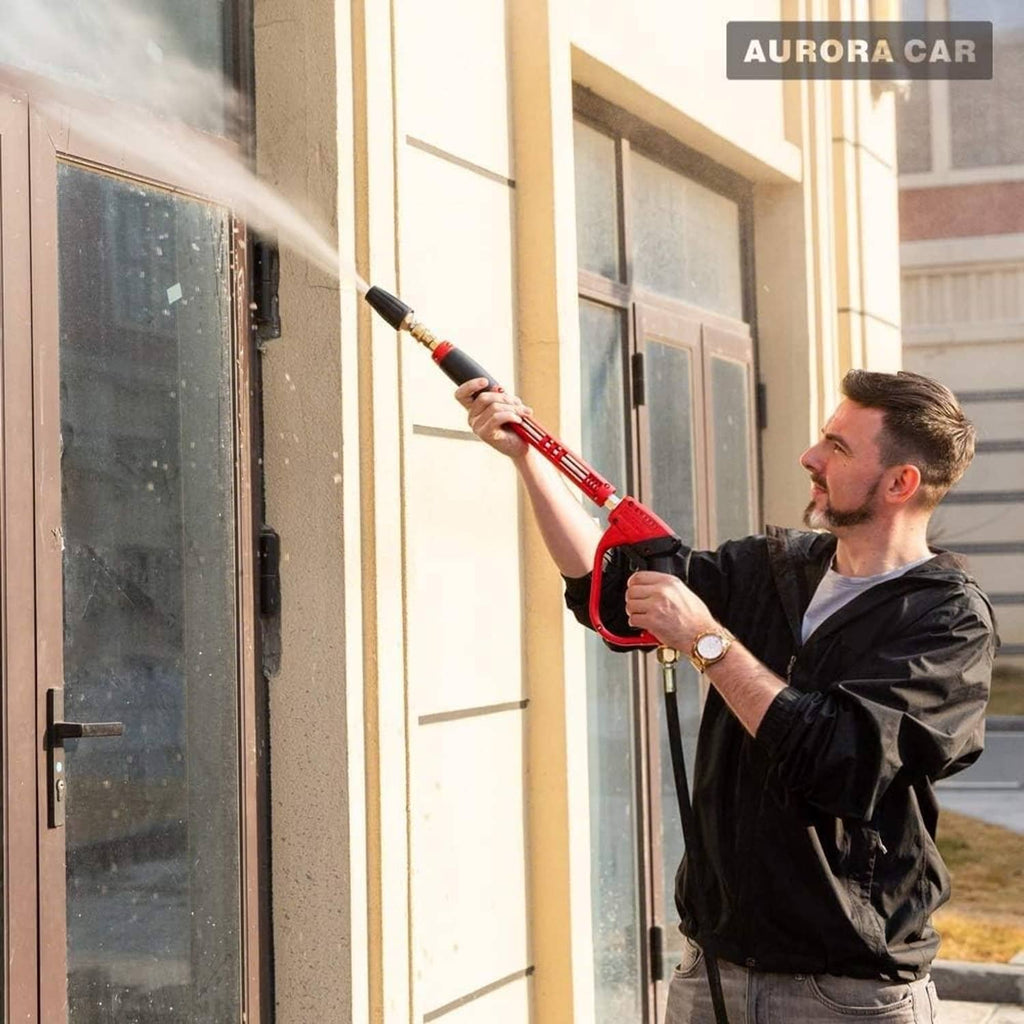 Pressure washer turbo nozzle attached to red spray wand, mist from nozzle