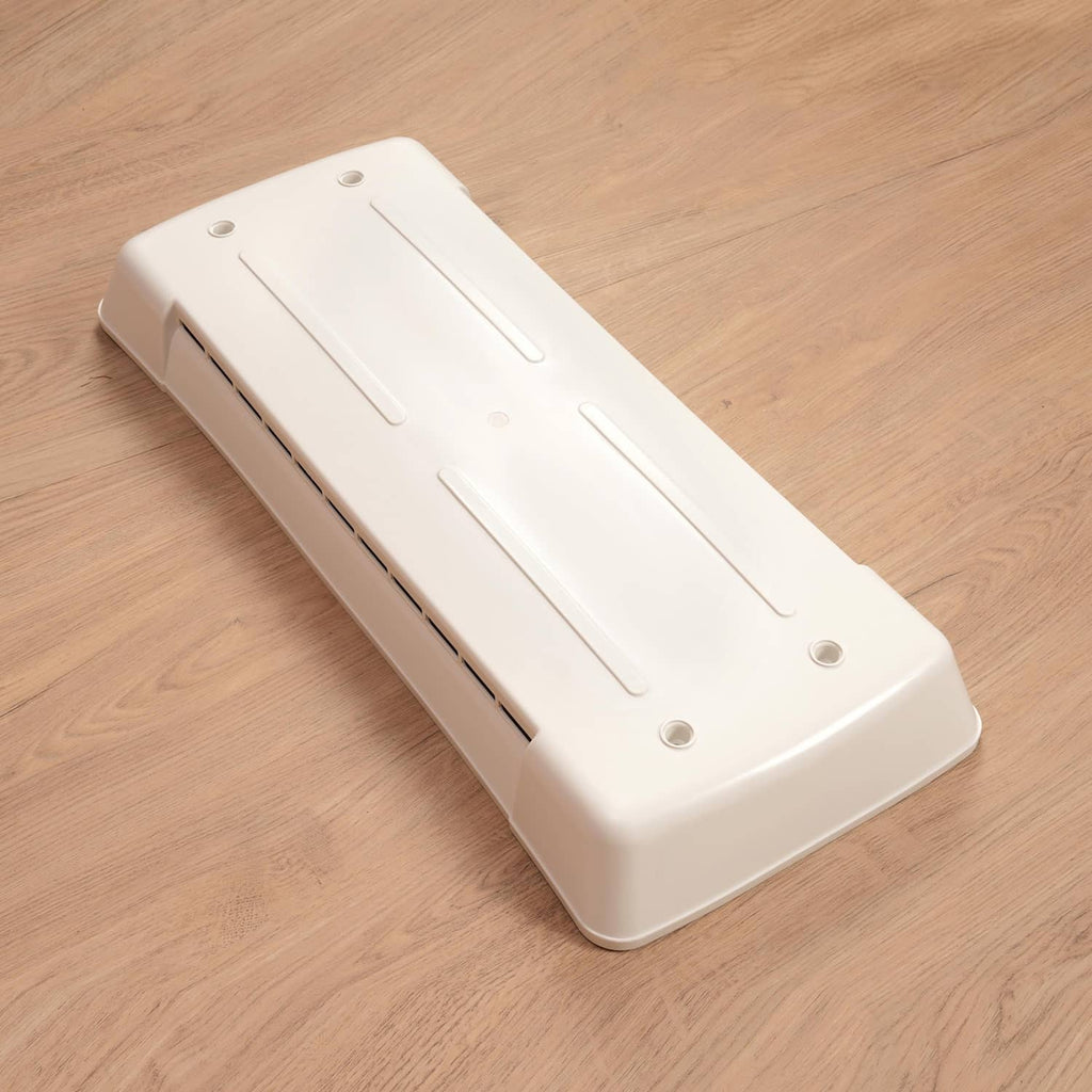 White refrigerator vent cover angled view of side vent opening and mounting holes