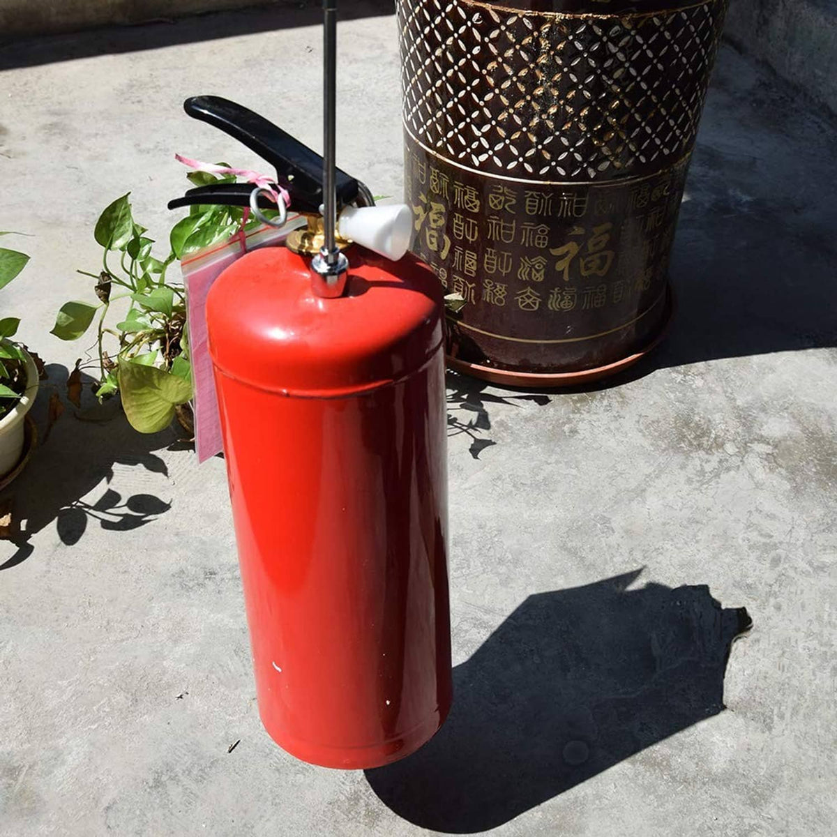 Orange telescoping magnetic pick-up tool with long rod and metal pickup end