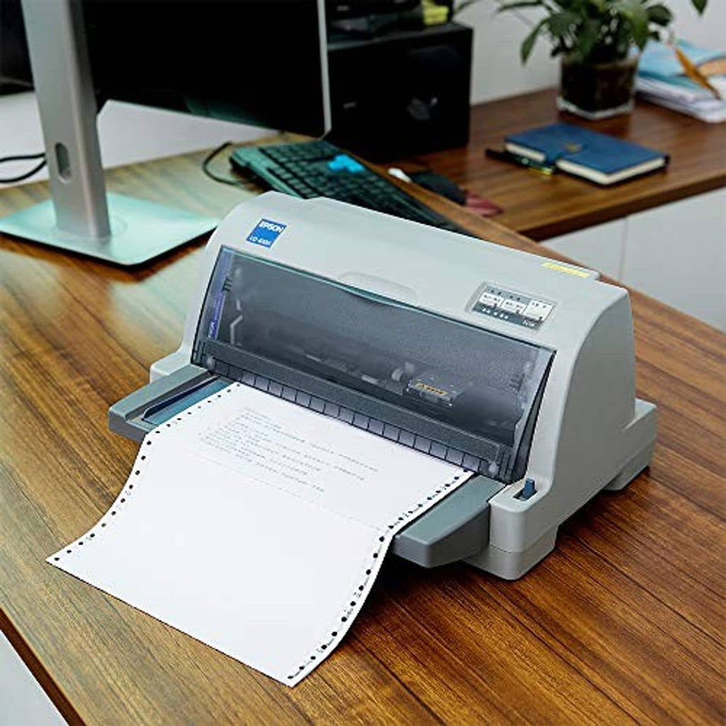 NCR continuous feed paper coming from dot-matrix printer with perforations visible