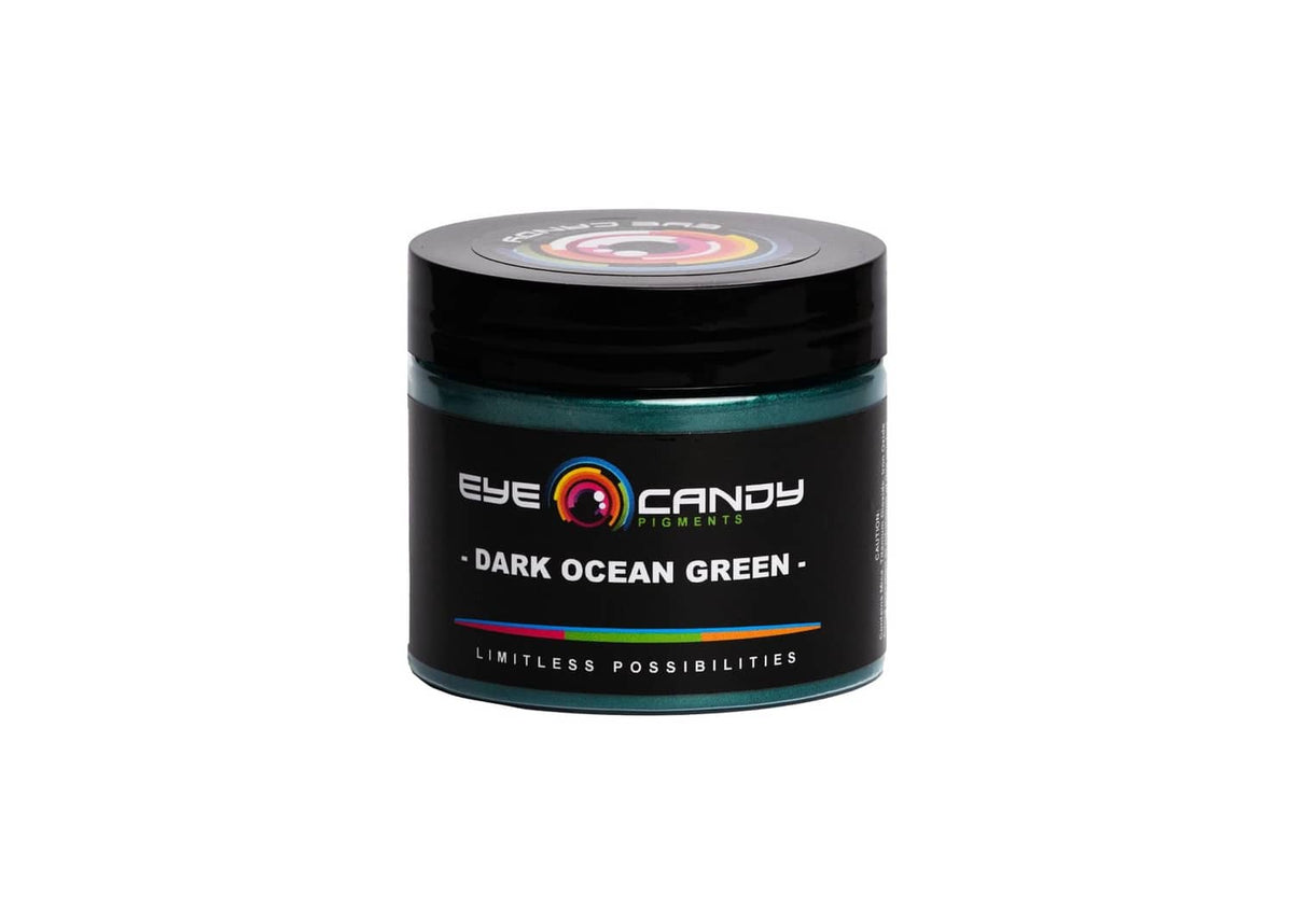 Dark green mica powder jar with black lid and teal shimmer label