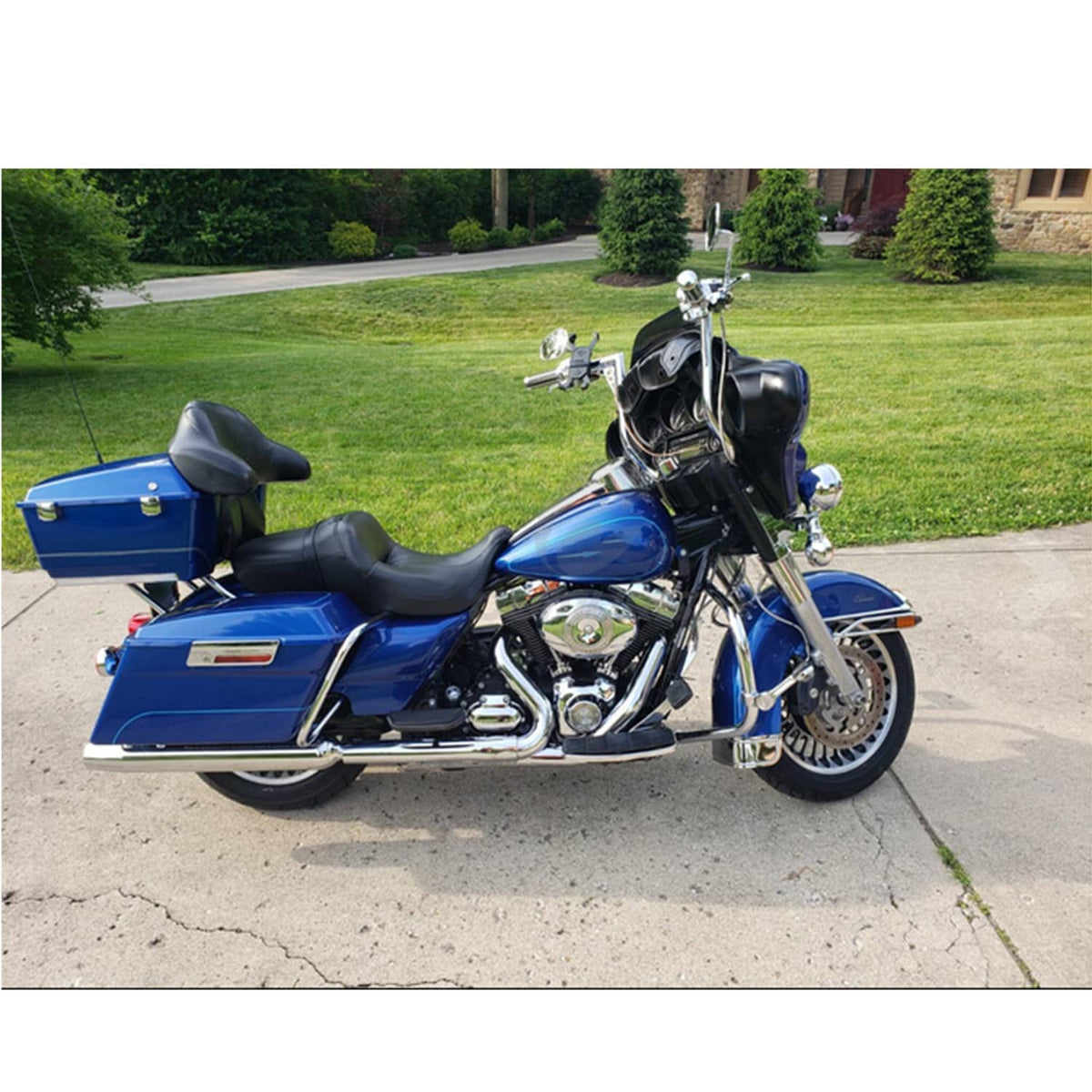 Ape hanger handlebar installed on blue touring motorcycle