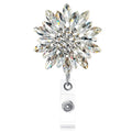 Sparkling crystal flower badge reel on silver clip with retractable cord
