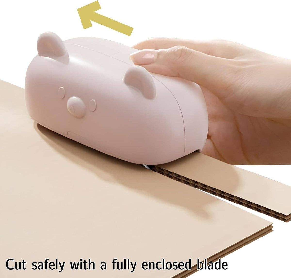 Kitten-shaped cardboard cutter with enclosed blade, pink shell slicing cardboard strip