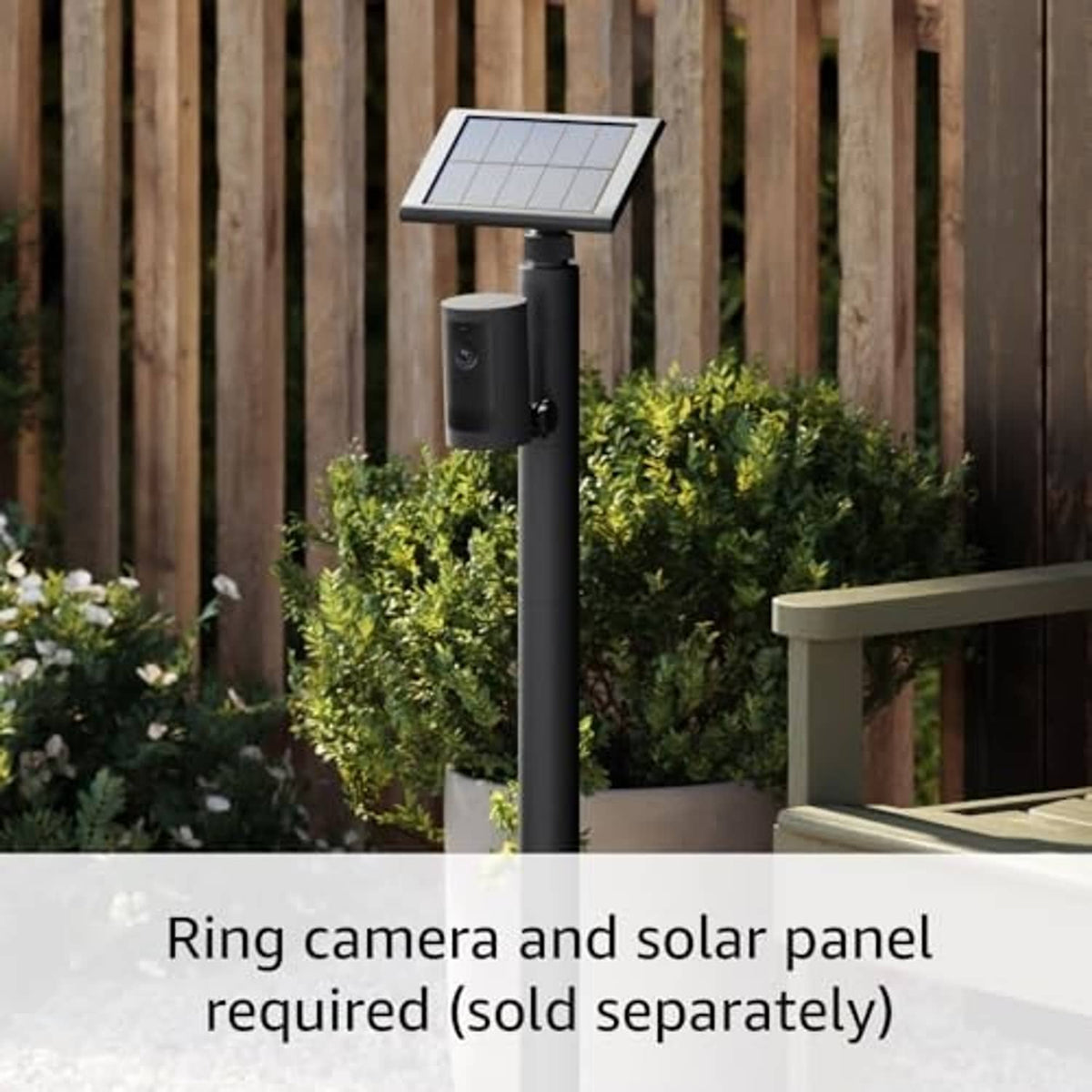 Ring camera and solar panel mounted on a black stake mount outdoors