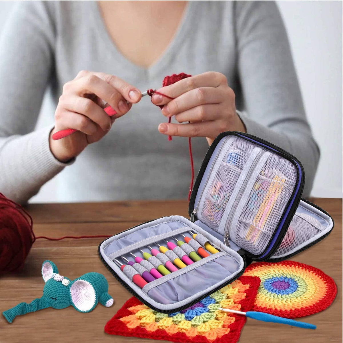Damero crochet hook case in use, open with hook slots and yarn tools inside