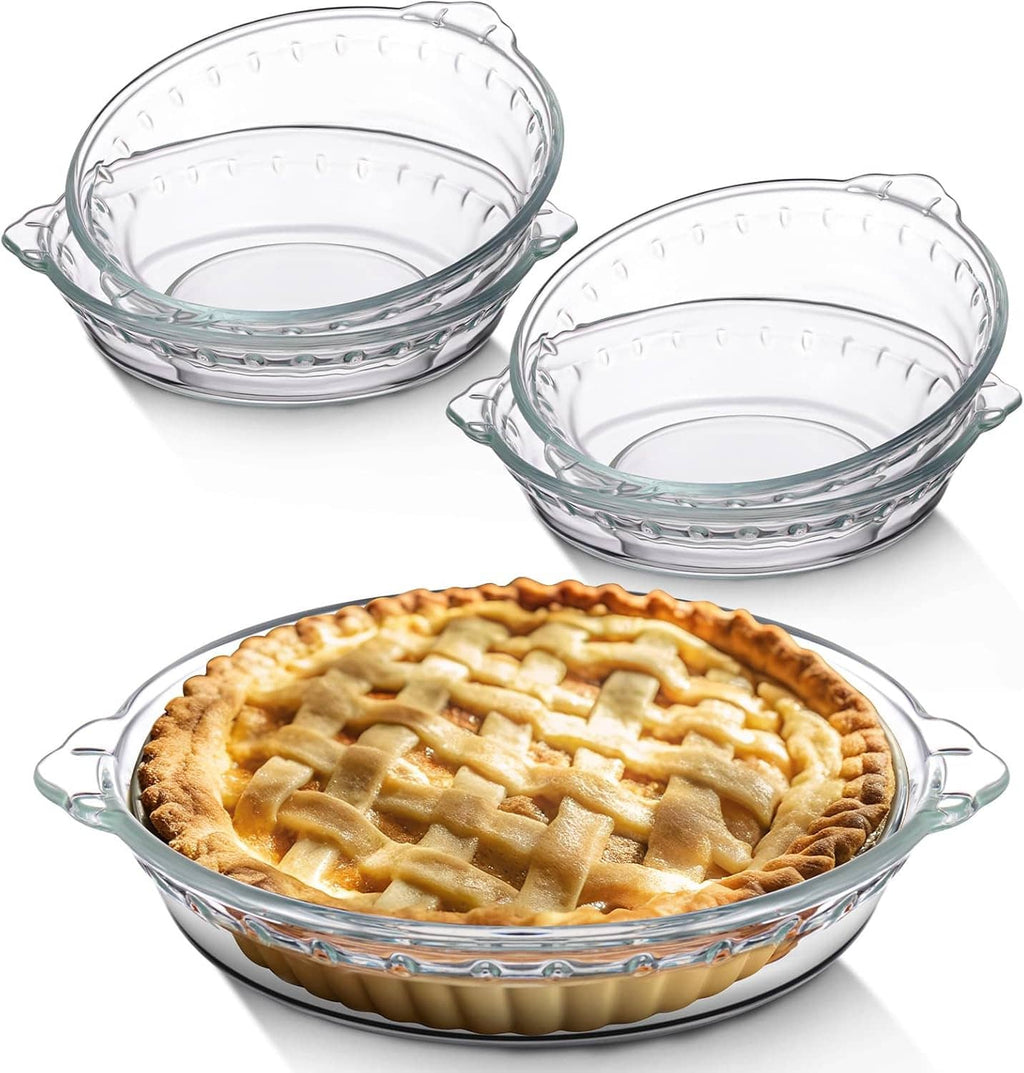 Set of clear glass mini pie pans with handles, holding a lattice-topped baked pie
