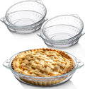 Set of clear glass mini pie pans with handles, holding a lattice-topped baked pie