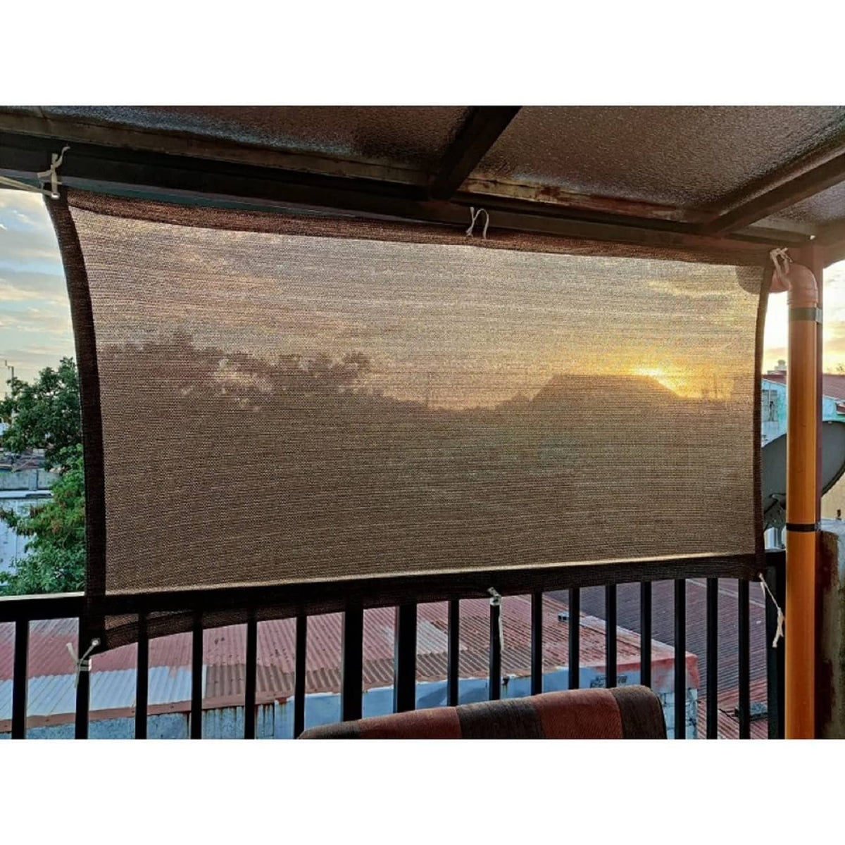 Coffee-brown balcony privacy screen cloth over metal railing, woven sun shade