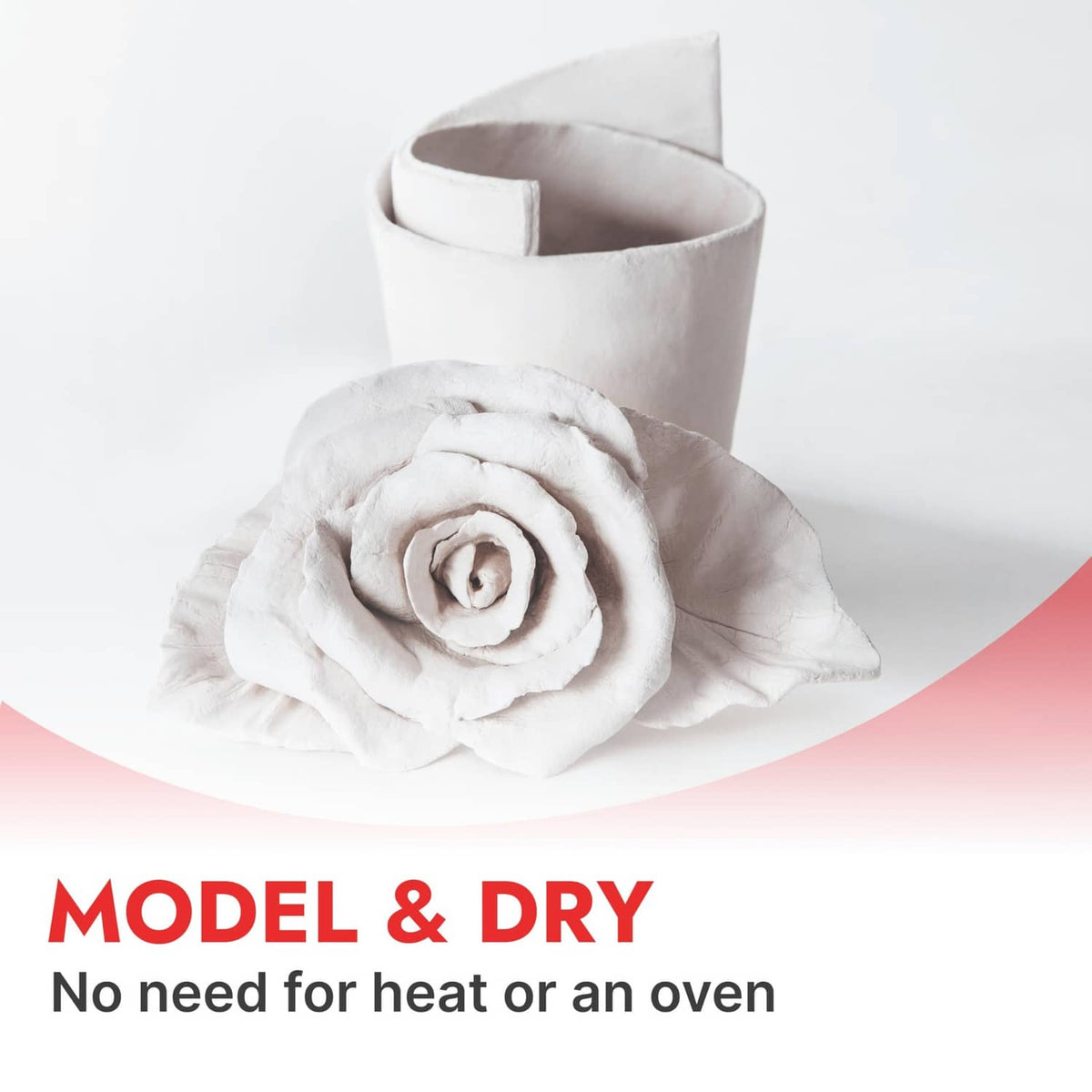 Air-dry clay model rose with a rolled flower on a gray sculpted base