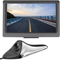 Car blind spot display and side camera system: gray monitor and silver camera lens.