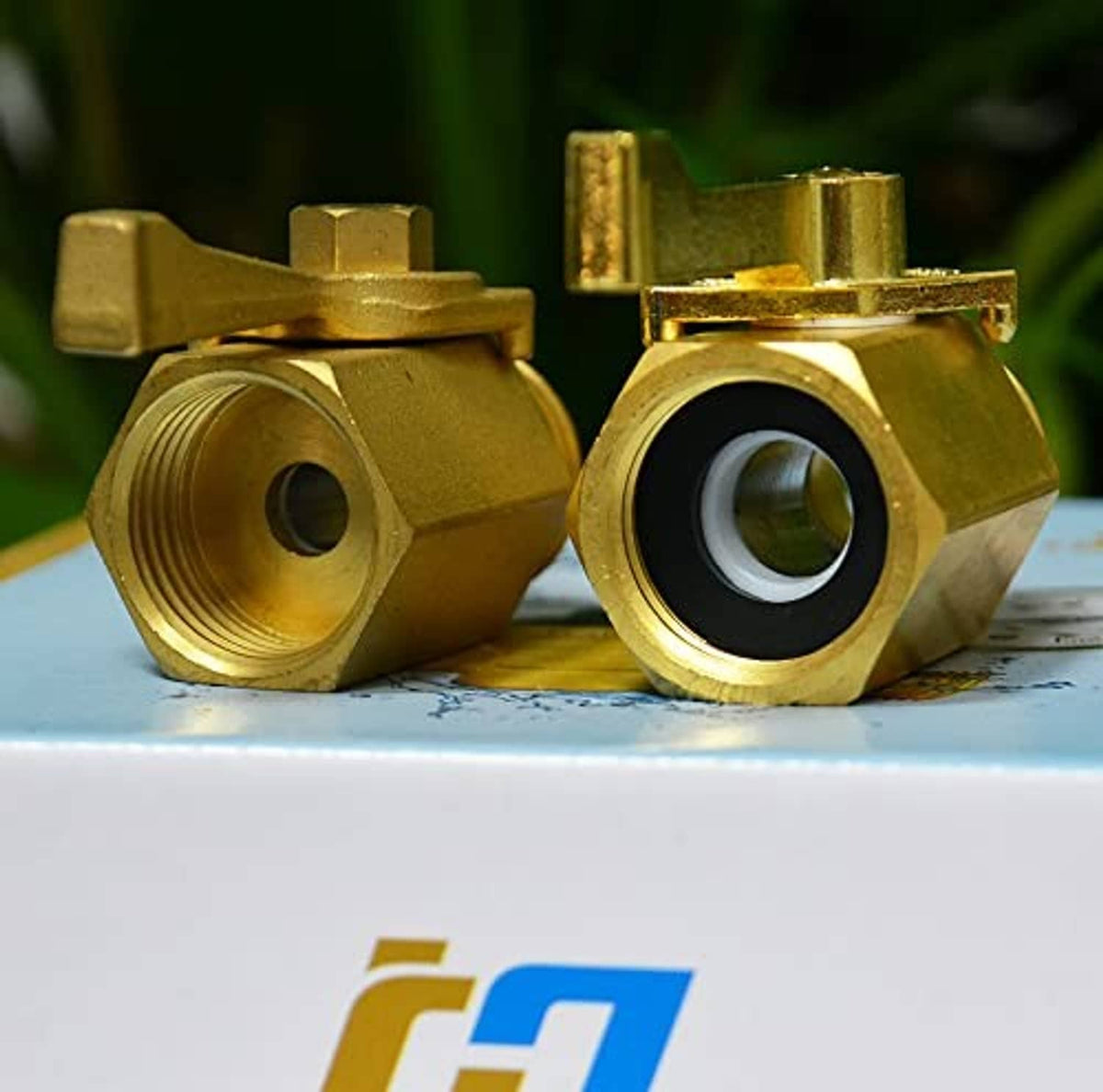 Brass shut-off valve with lever, two threaded ports, and visible black sealing insert