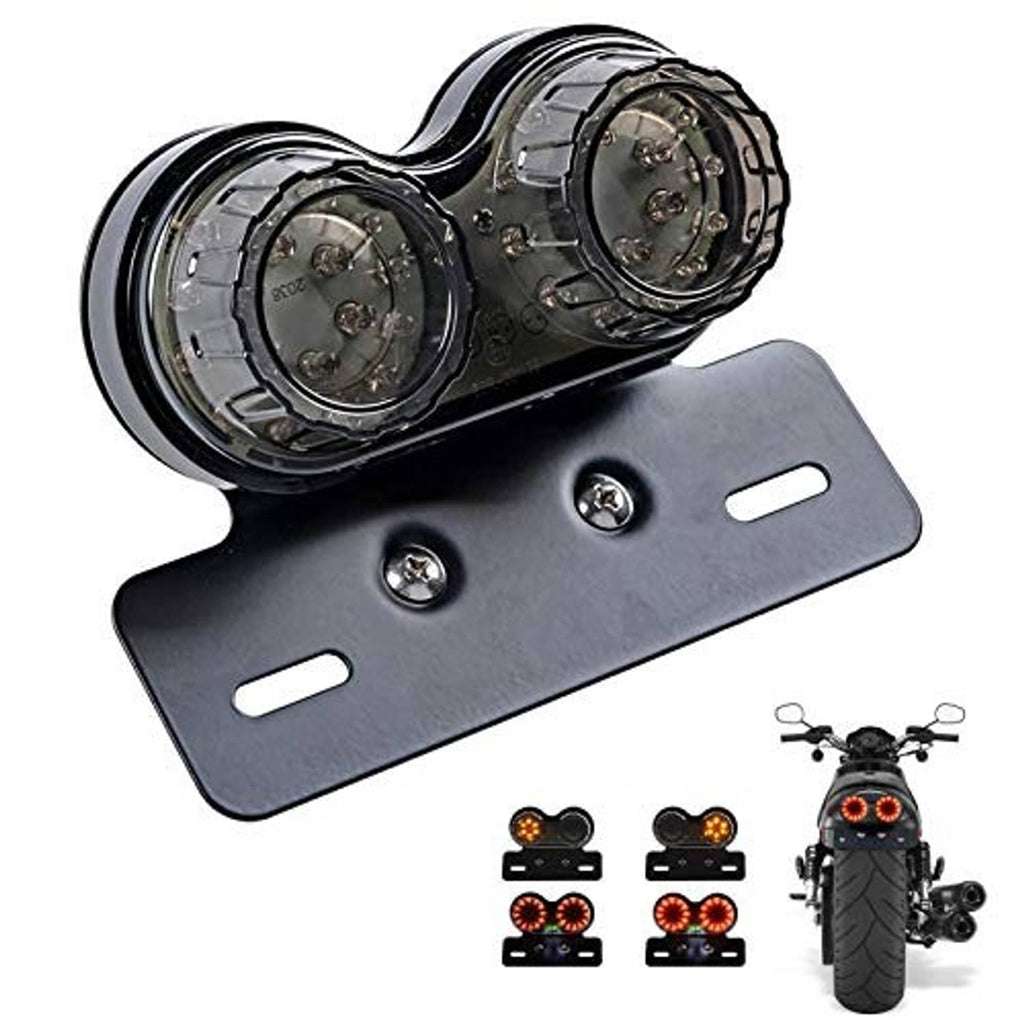 Motorcycle tail light assembly with black dual round LED lenses and metal license plate bracket