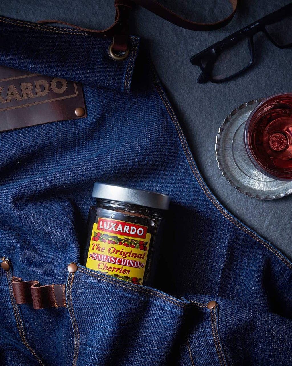 Luxardo maraschino cherries jar in blue denim pocket
