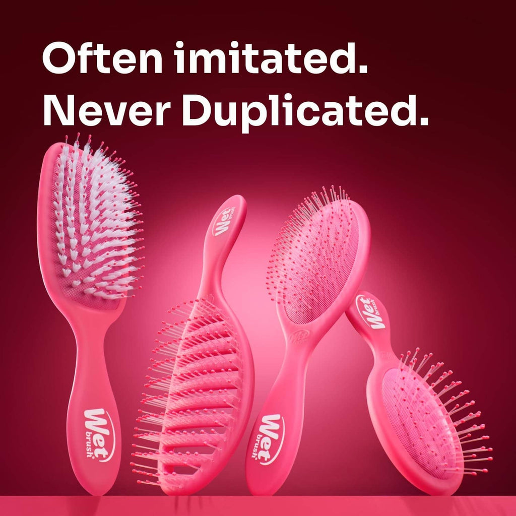Pink detangling brushes with oval heads and pin bristles, multiple sizes shown