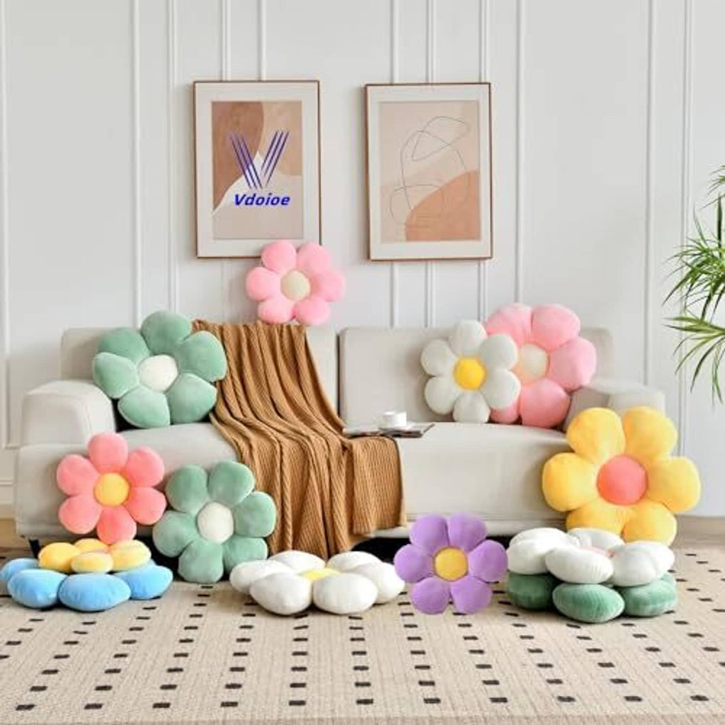 Pastel flower shaped throw pillows arranged on a sofa