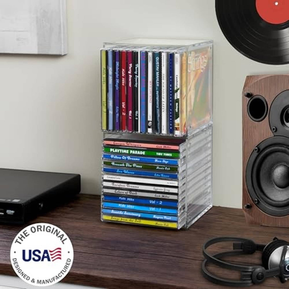 Clear plastic cube CD organizer holding multiple jewel cases, stacked two levels.