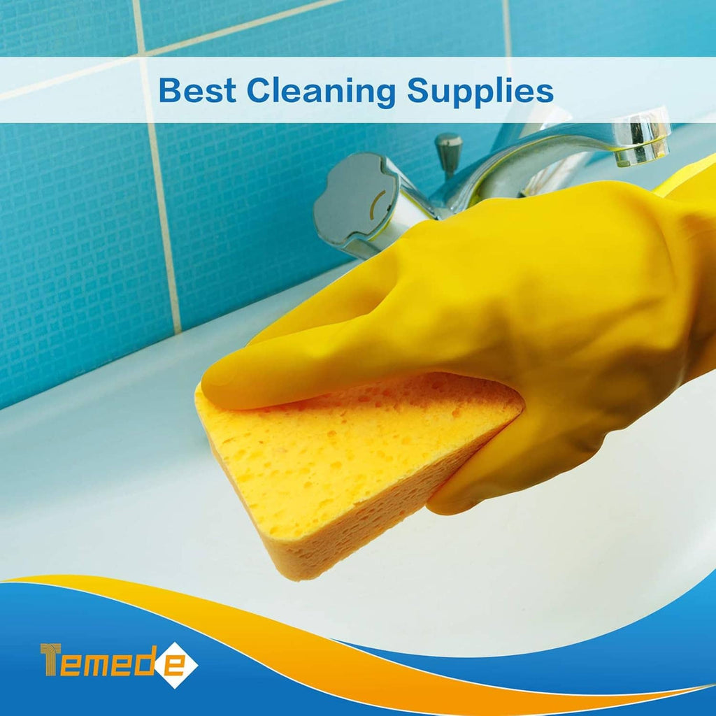 Yellow cellulose kitchen sponge held in a glove, thick porous block