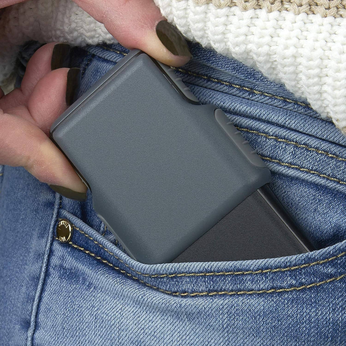 Gray LED magnifier tucked into a blue jeans pocket with protective sleeve