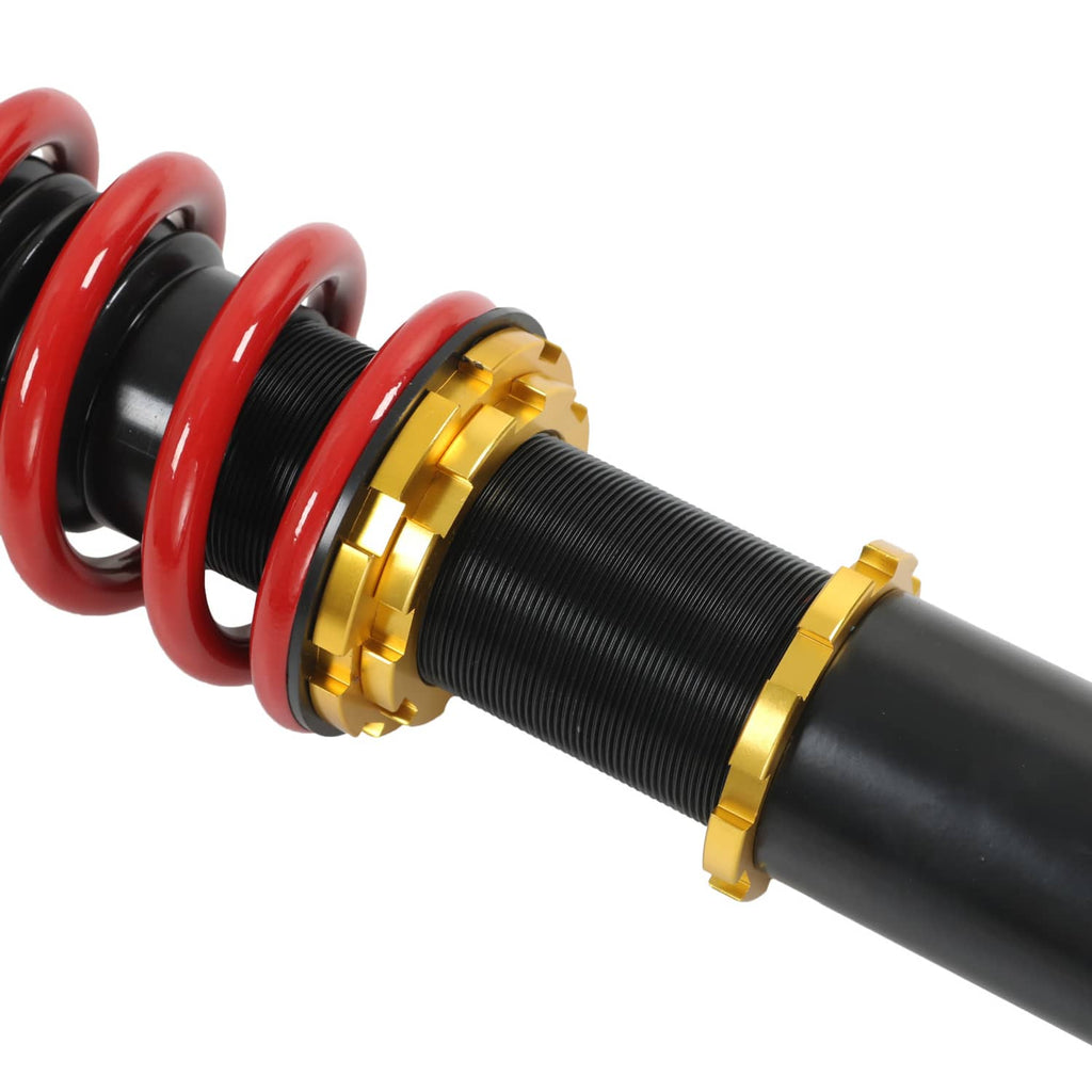 Coilover strut assembly with red spring, black body, and gold mounting collars