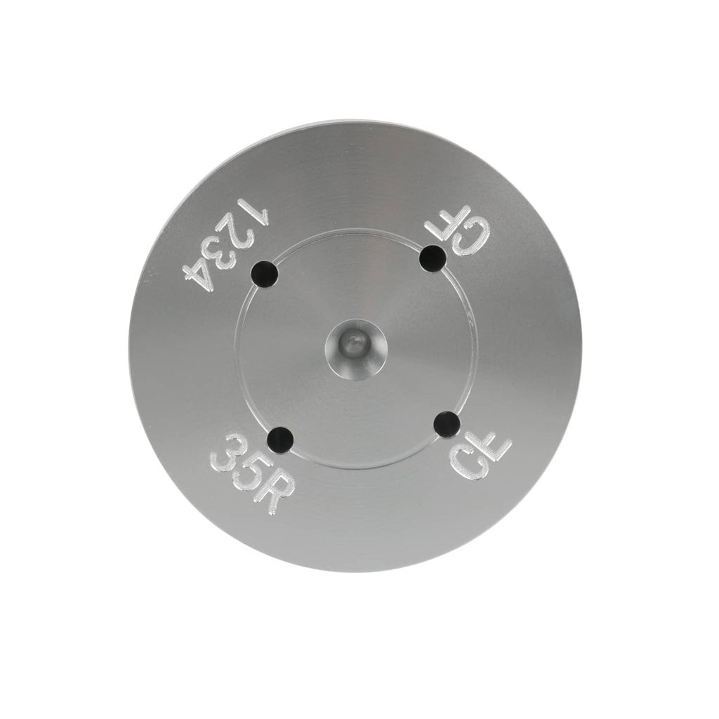 Metal drum tester end plate with four mounting holes and stamped scale markings