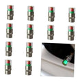 Set of silver tire valve stem caps with clear tops and green/amber/red indicator rings