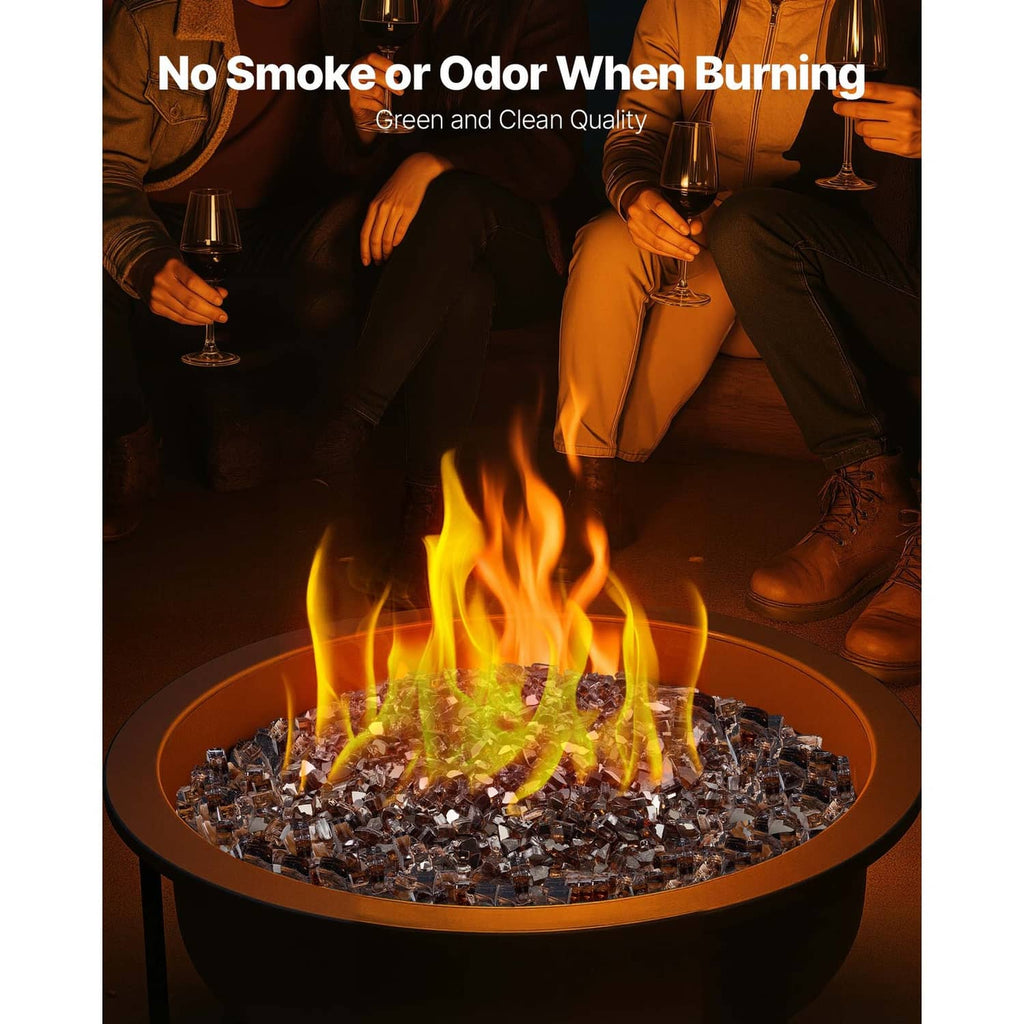 Copper crushed glass fire pit rocks in a round bowl with flames rising