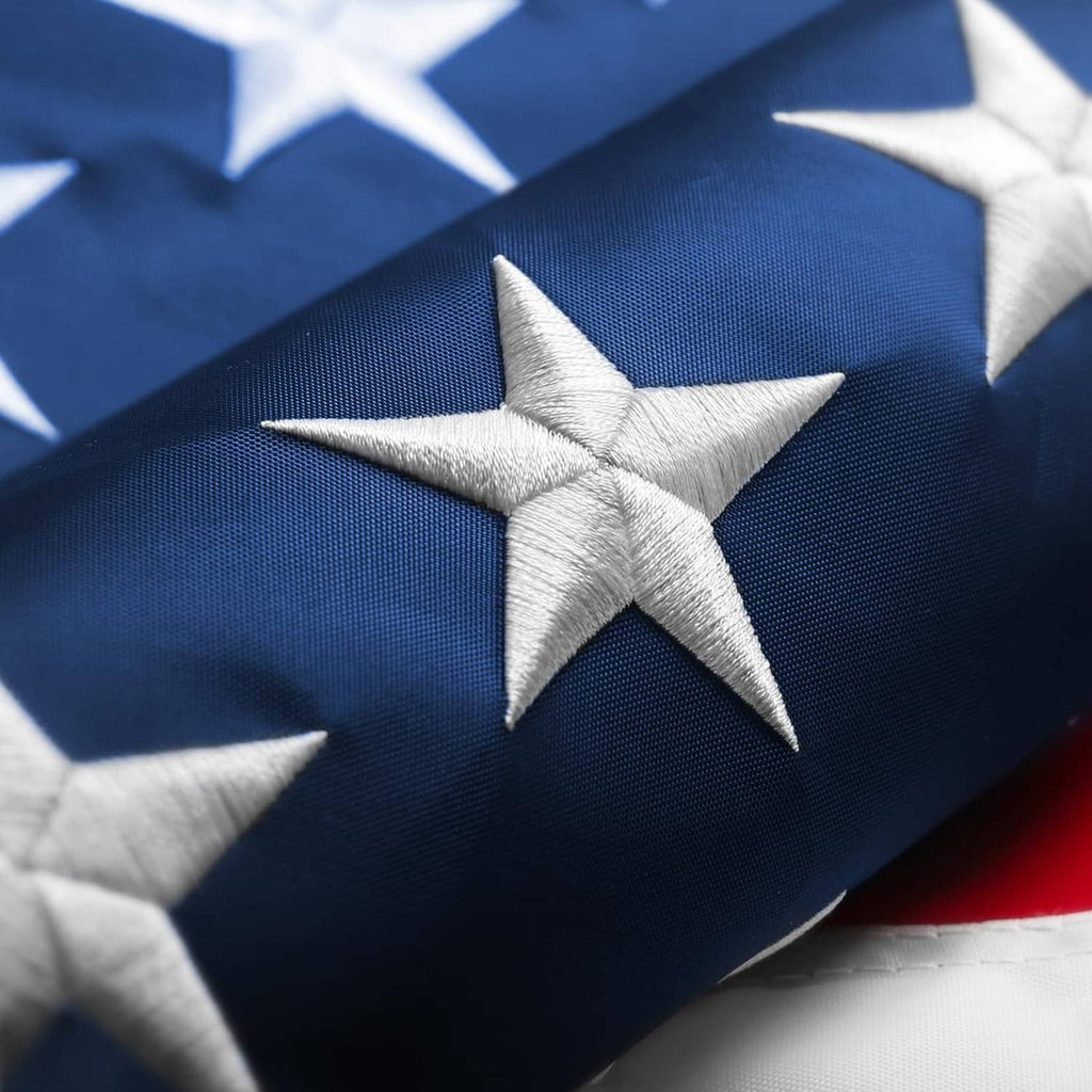 American flag close-up with dark blue field and white embroidered star