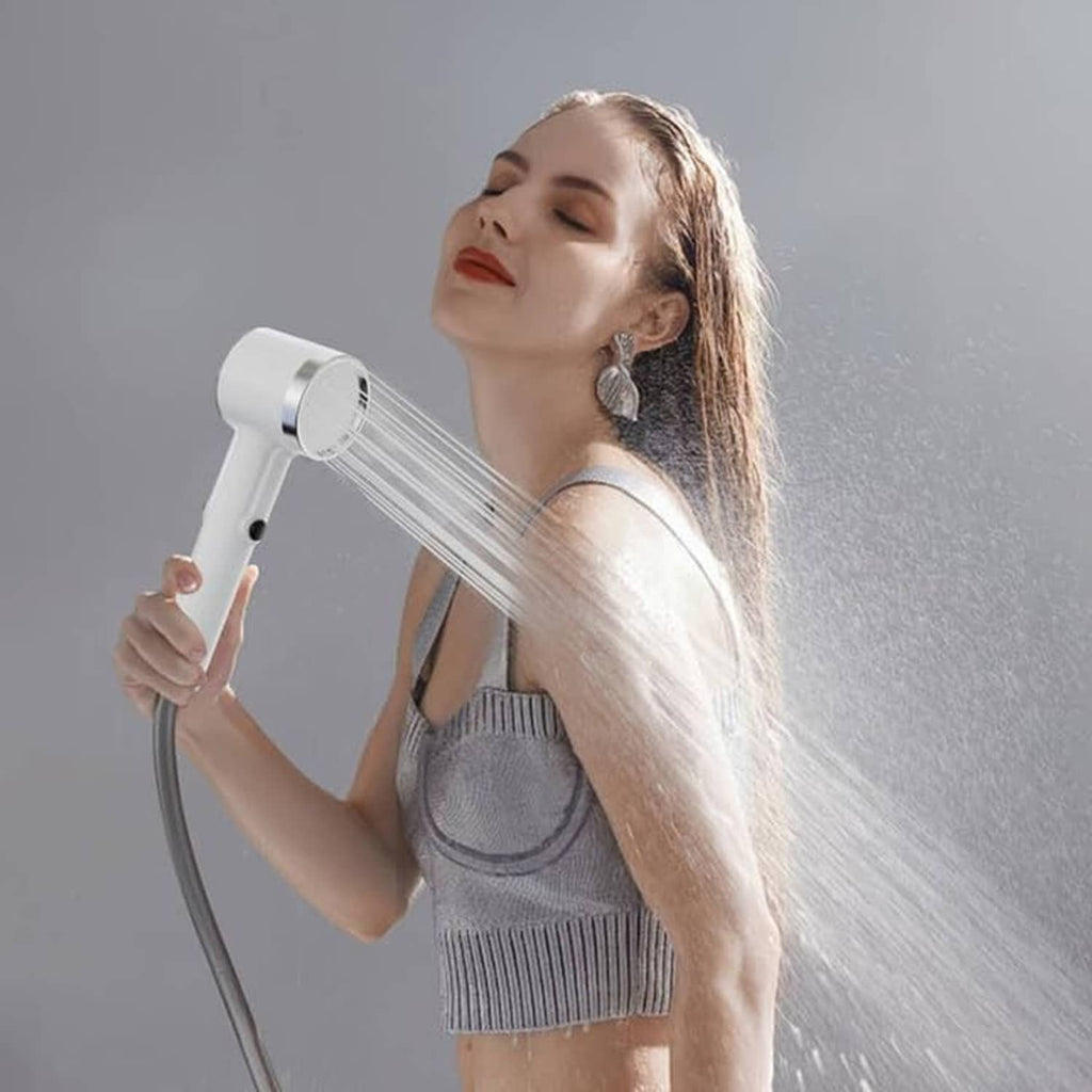 Portable shower head spraying water over shoulder with white pump and flexible hose