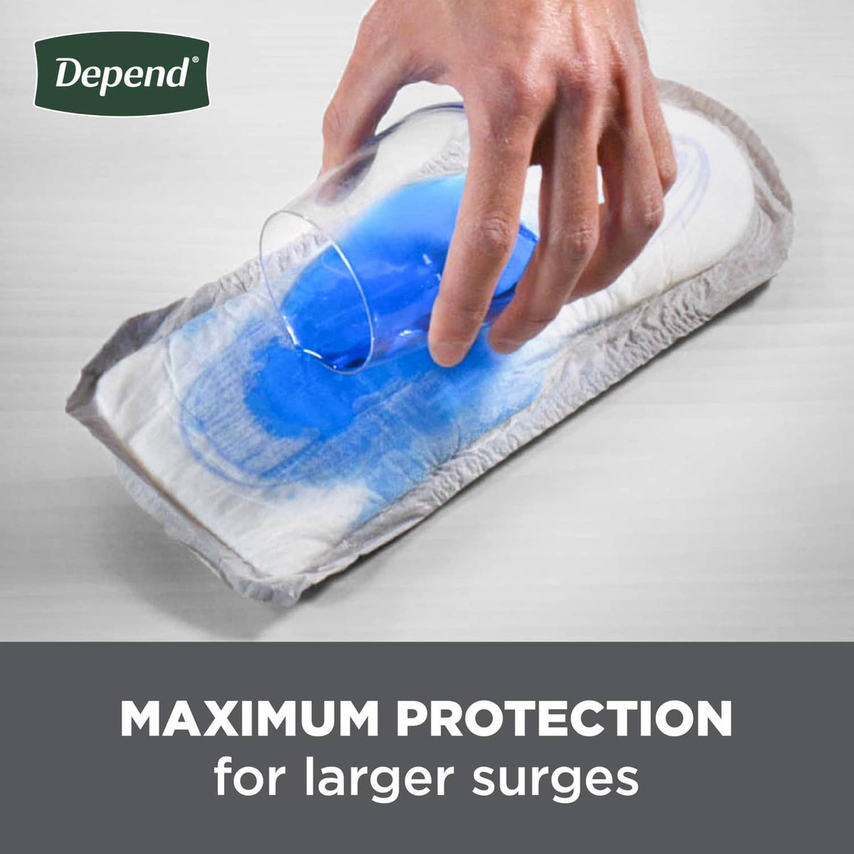 Men's incontinence guard being pressed, blue gel absorption graphic on the pad