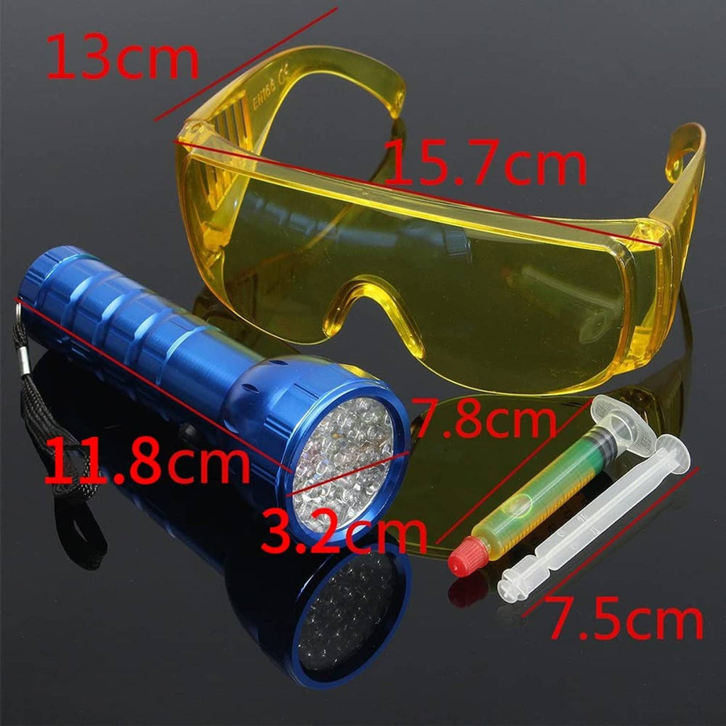 Leak detector kit items: yellow goggles, blue UV flashlight, and two syringes
