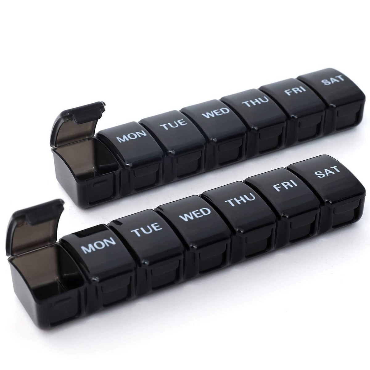 Black weekly pill organizer with hinged compartments labeled Mon–Sat, snap-shut lid