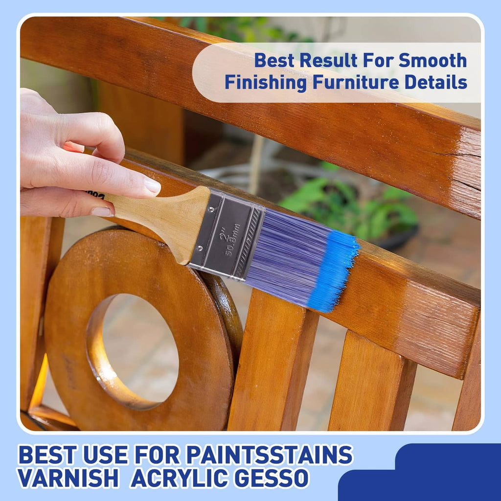 Flat paint brush painting a wooden surface, purple bristles on wood handle