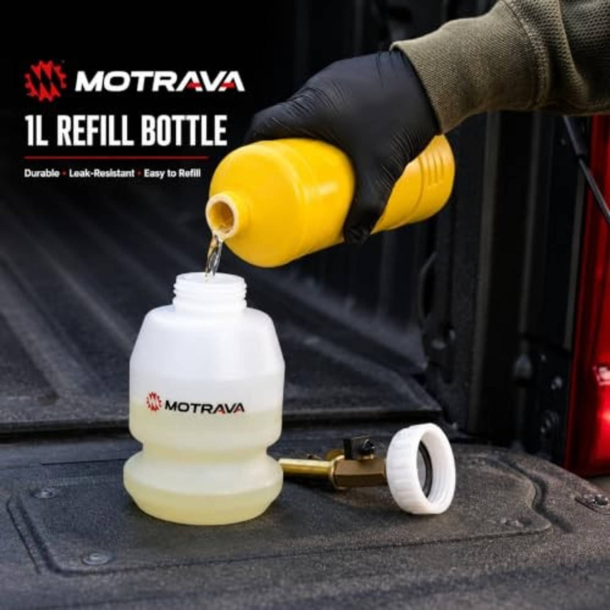1L refill bottle being filled with fluid from a yellow container