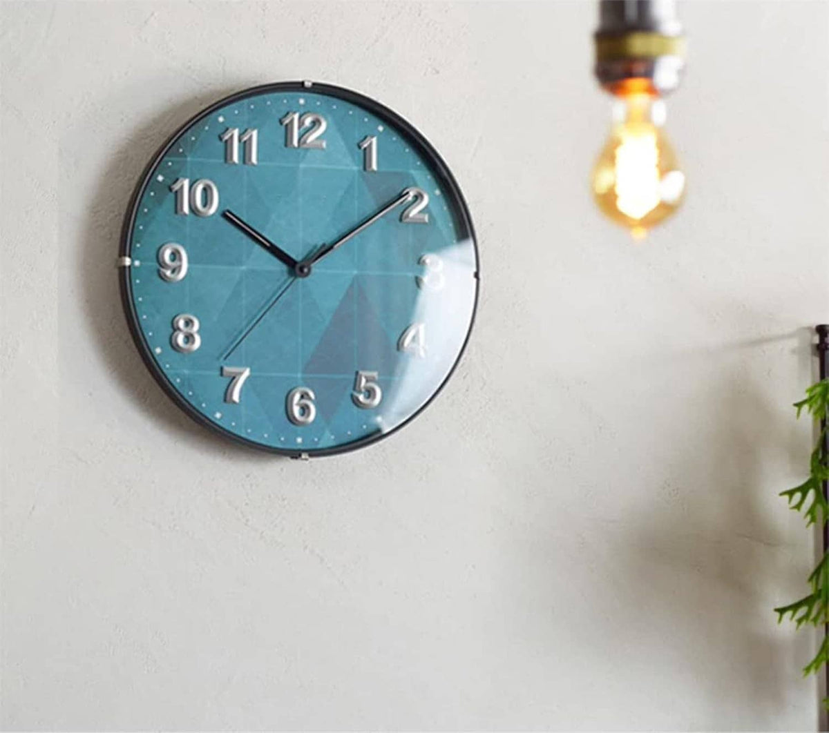 Blue wall clock with Roman numerals and black hands for 1 to 12