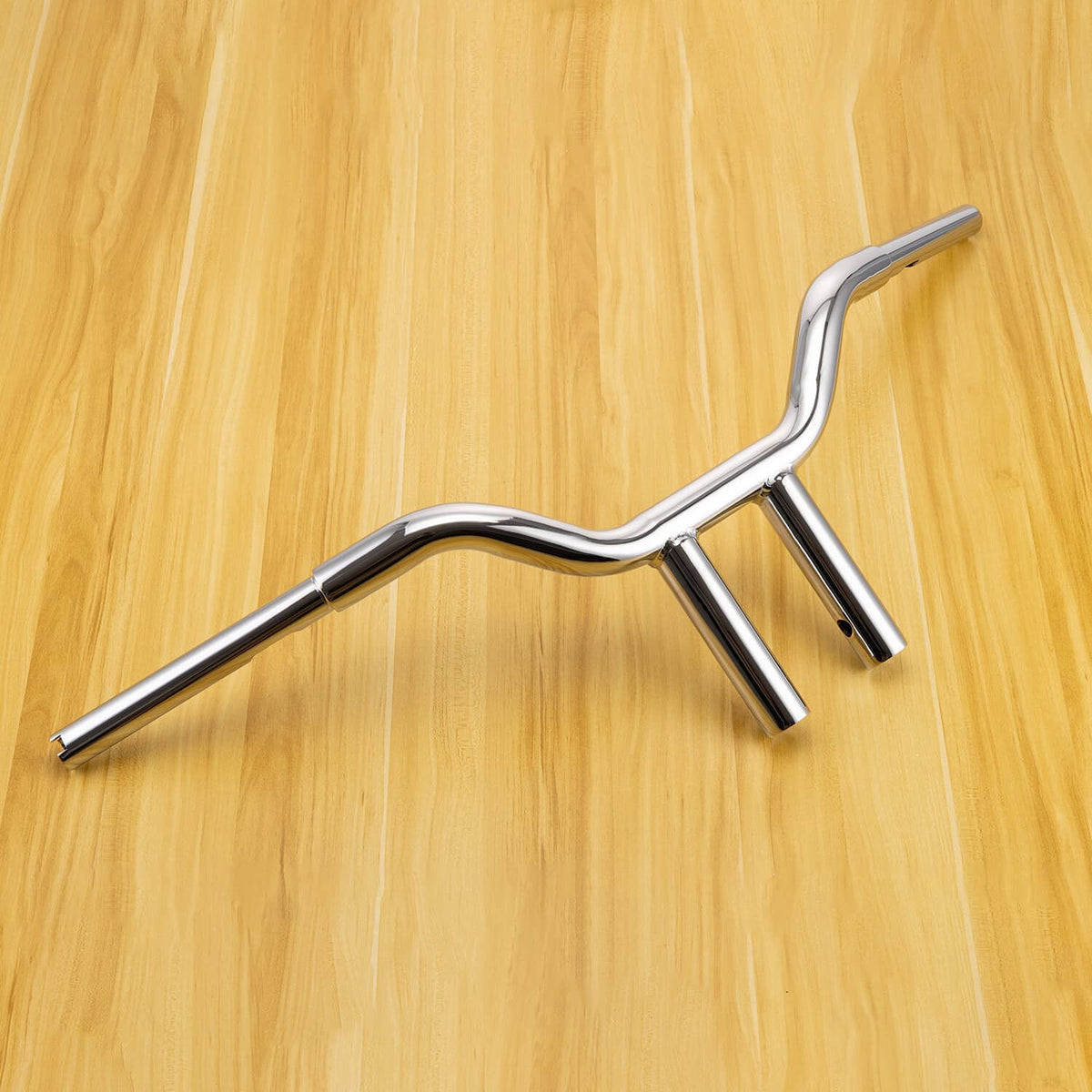 Chrome 10-inch T-bar handlebar, side view showing curved center and two upright mounts