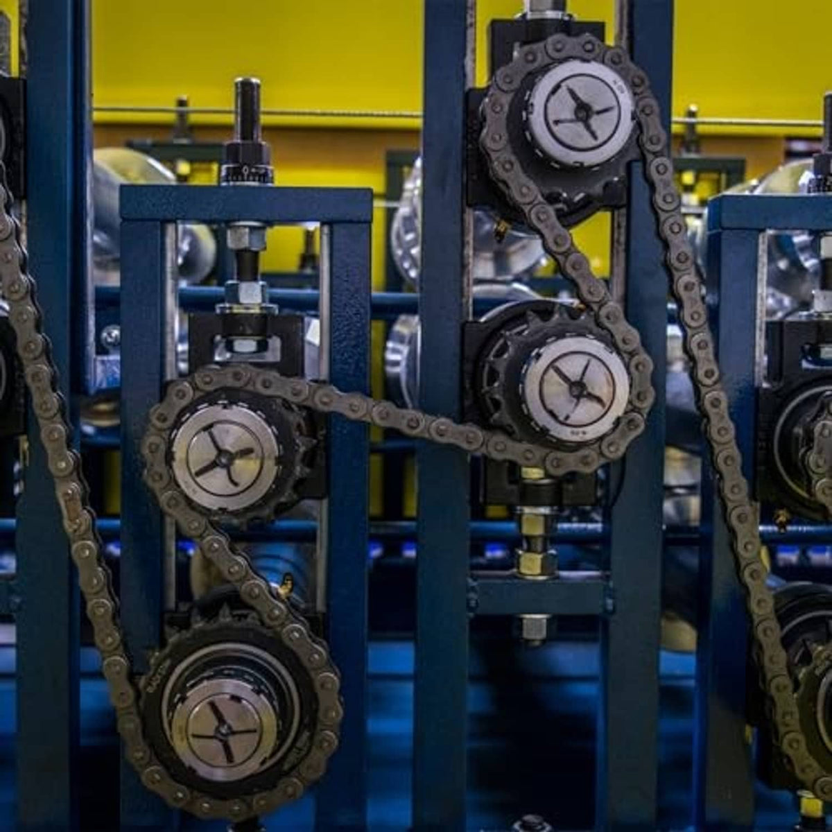 Industrial chain drive with multiple roller sprockets, including a black #40 sprocket