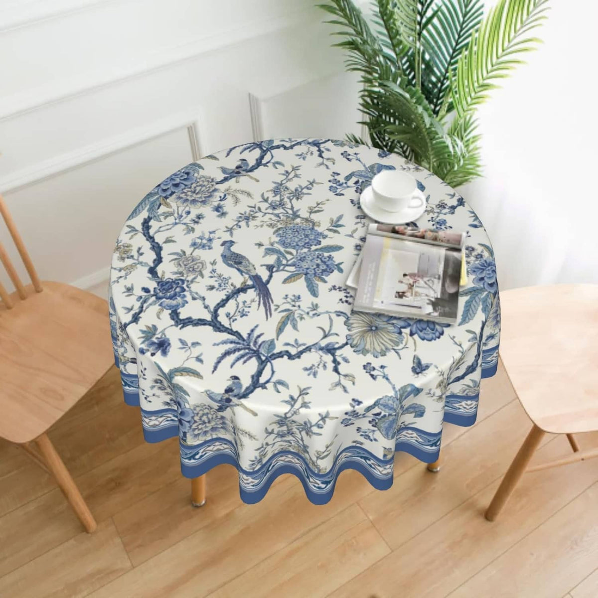 Round blue-and-white tablecloth with botanical print and scalloped wave edge