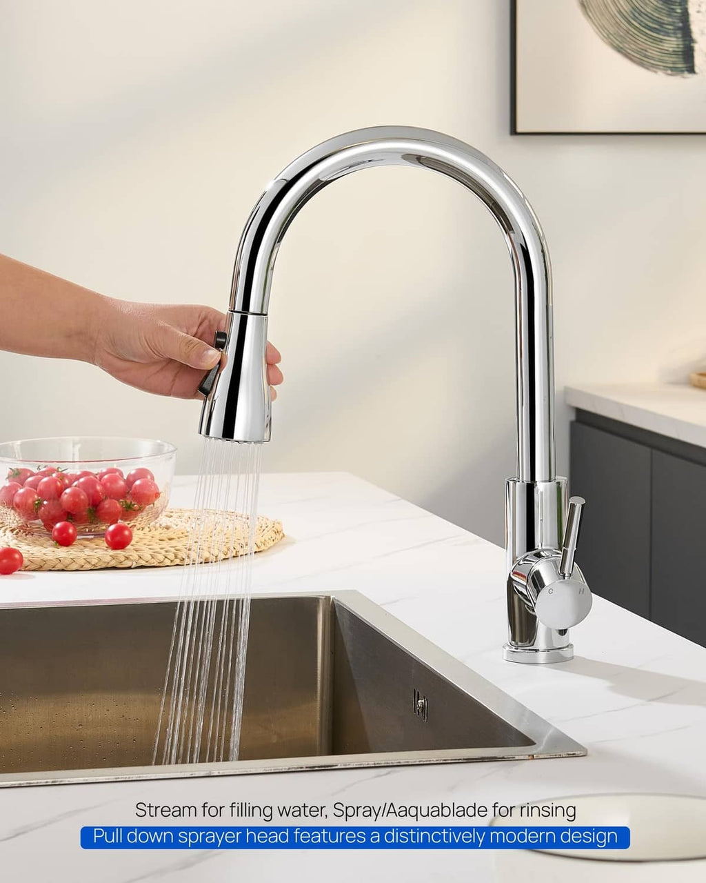Chrome kitchen faucet sprayer over sink with water stream coming from nozzle