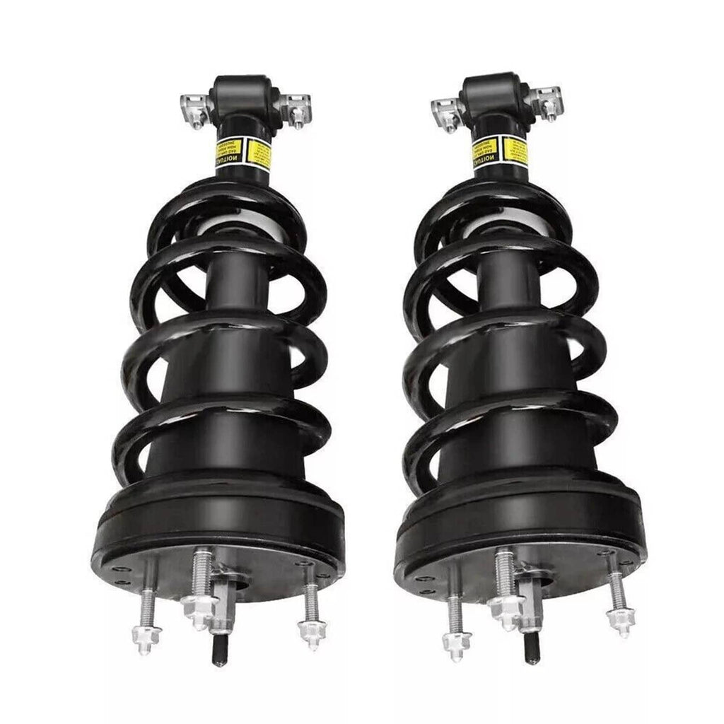 Two front shock struts side by side with black coil springs and top bracket hardware